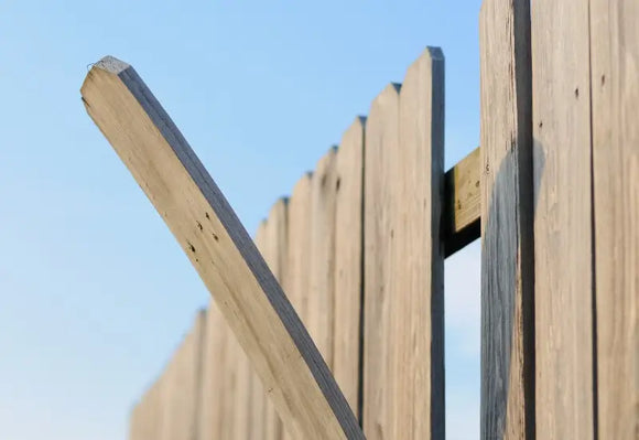 Residential wooden fence after a big storm in MA.