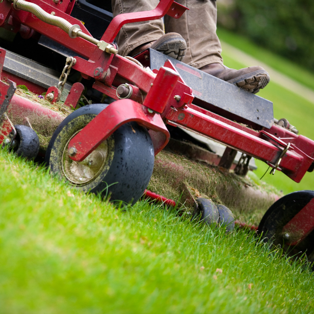 Man mowing a lawn in East Brookfield, MA